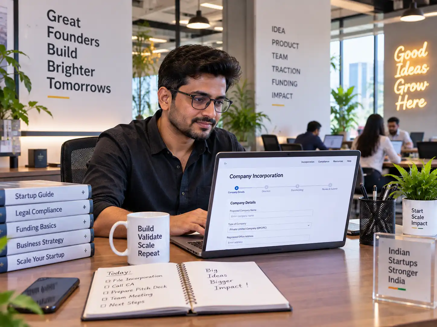 Young Indian startup founder at a co-working space desk
