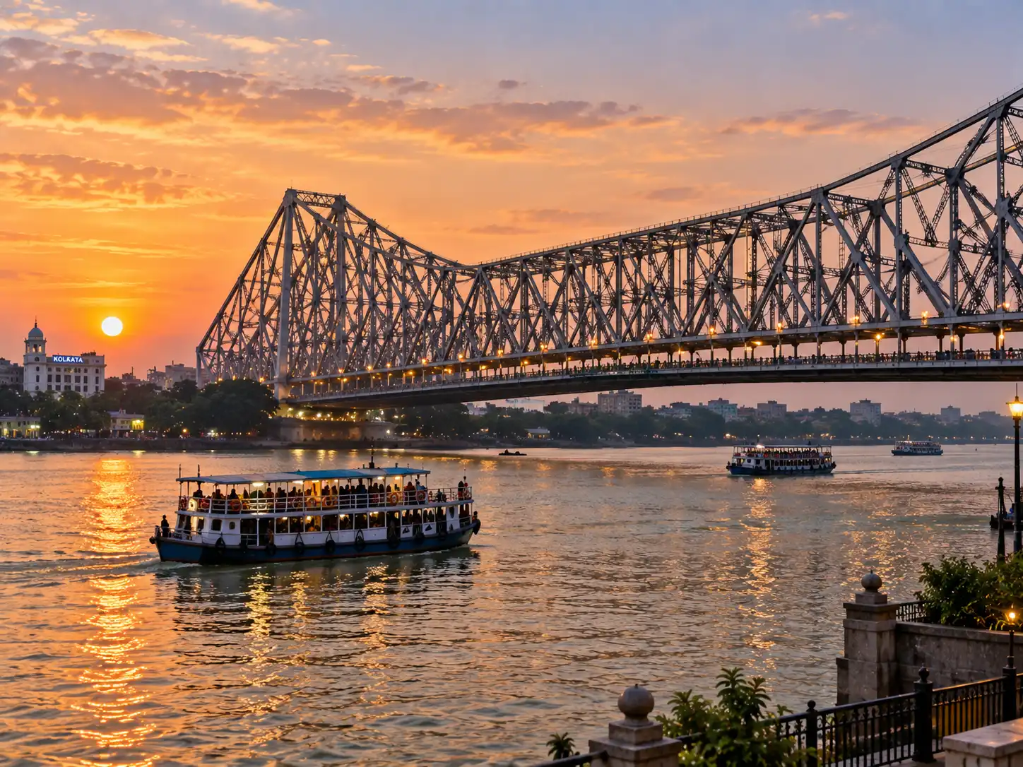 Howrah Bridge at sunset over the Hooghly river in Kolkata